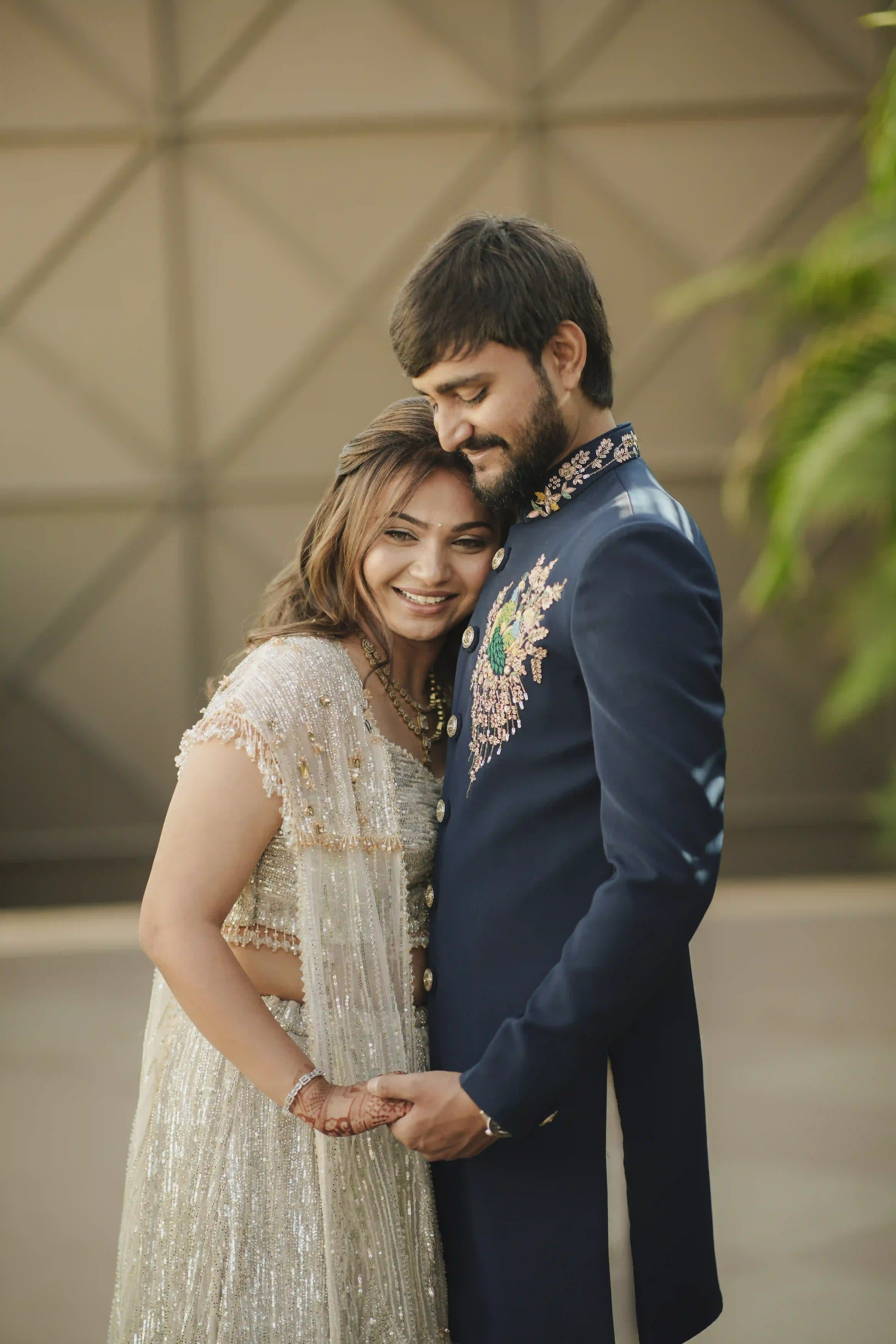 Couple sharing an intimate moment in elegant wedding attire